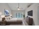 Main bedroom with vaulted ceilings, a ceiling fan, and sliding glass doors to the backyard pool at 1004 Black Knight Dr, Valrico, FL 33594