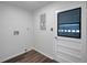 A functional utility room features modern flooring and exterior access at 1004 Black Knight Dr, Valrico, FL 33594