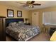 Comfortable bedroom features a patterned comforter, ample natural light, and neutral walls at 105 Lakeview Way # 105, Oldsmar, FL 34677