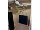 Walk in closet, with black door and some stored items at 105 Lakeview Way # 105, Oldsmar, FL 34677