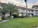 A well-maintained two-story exterior featuring balconies and mature landscaping at 105 Lakeview Way # 105, Oldsmar, FL 34677