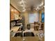 A functional kitchen featuring stainless steel appliances and counter seating at 105 Lakeview Way # 105, Oldsmar, FL 34677