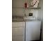 Convenient laundry area with a washing machine and dryer, simplifying household chores at 105 Lakeview Way # 105, Oldsmar, FL 34677