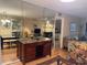 Open-concept living areas featuring dining, living room, and mirrored bar at 105 Lakeview Way # 105, Oldsmar, FL 34677