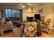 Inviting living room featuring a corner fireplace and sliding glass door to a patio at 105 Lakeview Way # 105, Oldsmar, FL 34677