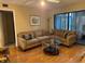 A comfortable living room with sliding doors leading to an outdoor balcony at 105 Lakeview Way # 105, Oldsmar, FL 34677