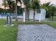 A utility shed and a glimpse of the community pool in the distance at 105 Lakeview Way # 105, Oldsmar, FL 34677