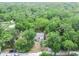 Aerial view displays the home and large property surrounded by trees at 10537 Fran St, New Port Richey, FL 34654