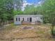 Exterior of home features a small porch at 10537 Fran St, New Port Richey, FL 34654