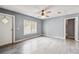 Living room with a ceiling fan and hardwood floors at 10537 Fran St, New Port Richey, FL 34654