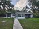Charming single-story home with a well-maintained backyard and walkway at 11107 Riverview Dr, Riverview, FL 33578