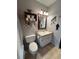 This bathroom offers a sink with vanity and an abundance of nautical decorations at 11107 Riverview Dr, Riverview, FL 33578