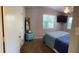 Bedroom with neutral paint, a ceiling fan, TV, and a light-filled window at 11107 Riverview Dr, Riverview, FL 33578