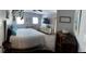 Bedroom with a queen bed, ceiling fan, natural light, and vintage decor at 11107 Riverview Dr, Riverview, FL 33578