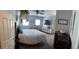 Bedroom with a queen bed, ceiling fan, natural light, and vintage decor at 11107 Riverview Dr, Riverview, FL 33578