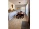 Cozy dining area with wood table set by a window, featuring a decorative wall accent at 11107 Riverview Dr, Riverview, FL 33578