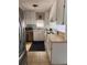 Traditional kitchen with white cabinets, stainless steel appliances, and a functional layout at 11107 Riverview Dr, Riverview, FL 33578
