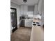 Practical kitchen featuring white cabinets, stainless steel appliances, and ample counter space at 11107 Riverview Dr, Riverview, FL 33578