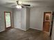 A cozy living room with a ceiling fan, neutral walls, and carpet flooring at 11107 Riverview Dr, Riverview, FL 33578