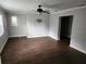 An empty living room featuring newly installed wood look flooring at 11107 Riverview Dr, Riverview, FL 33578
