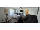 Spacious living room featuring wood floors, lots of light, and neutral color scheme at 11107 Riverview Dr, Riverview, FL 33578