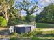 Above-ground pool in a green, tree-lined backyard at 11107 Riverview Dr, Riverview, FL 33578