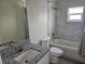 Bright bathroom features granite countertops, tub-shower combo with marble-style tile, and neutral colors at 11210 Mcmullen Rd, Riverview, FL 33569