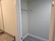 Bright closet featuring a new wire rack for storage, adjacent to the bathroom and newly installed floors at 11210 Mcmullen Rd, Riverview, FL 33569