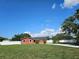 Charming single-story home featuring a spacious lawn, freshly painted exterior, and well-maintained landscaping at 11210 Mcmullen Rd, Riverview, FL 33569