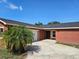 Beautiful exterior view of home with a well-kept lawn, a two-car garage, and a welcoming front entrance at 11210 Mcmullen Rd, Riverview, FL 33569