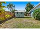Spacious backyard featuring a shed, manicured lawn, and a wooden fence at 11296 90Th Ave, Seminole, FL 33772