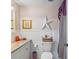 Traditional bathroom featuring white cabinets, granite counters, and decorative accents at 11296 90Th Ave, Seminole, FL 33772