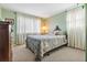 This bedroom has a comfortable bed and lots of natural light from the windows at 11296 90Th Ave, Seminole, FL 33772