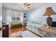 This bedroom offers natural light from the window, and features a white daybed at 11296 90Th Ave, Seminole, FL 33772