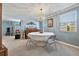 Charming dining room with a chandelier, neutral carpet, and light blue walls at 11296 90Th Ave, Seminole, FL 33772