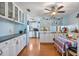 Bright kitchen featuring white cabinets, butcher block countertops, and a spacious dining area at 11296 90Th Ave, Seminole, FL 33772