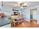 Kitchen area featuring a cozy dining table, ceiling fan, and natural light at 11296 90Th Ave, Seminole, FL 33772