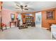 Cozy living room featuring neutral carpet, a ceiling fan, and a doorway leading to other rooms at 11296 90Th Ave, Seminole, FL 33772