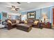 Cozy living room with plush leather sofas, ottoman and stylish accents at 11296 90Th Ave, Seminole, FL 33772