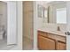Bathroom featuring single sink vanity, and walk-in closet at 11627 Ivy Flower Loop, Riverview, FL 33578