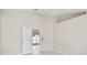 Bright, spacious bedroom showcasing high ceilings and white tile flooring at 11627 Ivy Flower Loop, Riverview, FL 33578