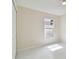 Bright bedroom featuring tiled floor, a ceiling fan, and a window at 11627 Ivy Flower Loop, Riverview, FL 33578