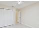 Bedroom featuring tiled floor, closet, ceiling fan, and access to a hallway at 11627 Ivy Flower Loop, Riverview, FL 33578