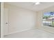 Bright bedroom featuring tiled floor, a ceiling fan, and a window at 11627 Ivy Flower Loop, Riverview, FL 33578