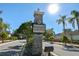 Stone monument sign for the Symmes Grove neighborhood with mature landscaping at 11627 Ivy Flower Loop, Riverview, FL 33578