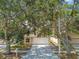 Single-Gathering home featuring mature shade trees, a well-maintained lawn, and a two-car garage at 11627 Ivy Flower Loop, Riverview, FL 33578