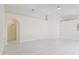 Large open living room with bright tile flooring and vaulted ceilings at 11627 Ivy Flower Loop, Riverview, FL 33578