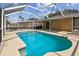 Enjoy a refreshing swim in the screened-in pool, surrounded by a concrete patio for outdoor relaxation at 11627 Ivy Flower Loop, Riverview, FL 33578