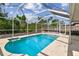 Bright screened-in pool offering a private oasis for swimming and outdoor fun with Gathering and friends at 11627 Ivy Flower Loop, Riverview, FL 33578