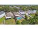 Aerial view of a home featuring a screened-in pool and fully fenced yard at 11627 Ivy Flower Loop, Riverview, FL 33578